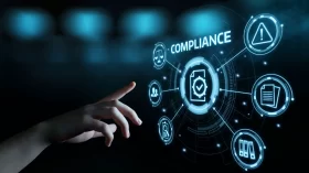 Finger pointing to the word compliance on a digital interface